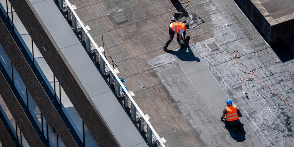 birds eye view of professional bitumen waterproofing on a flat building